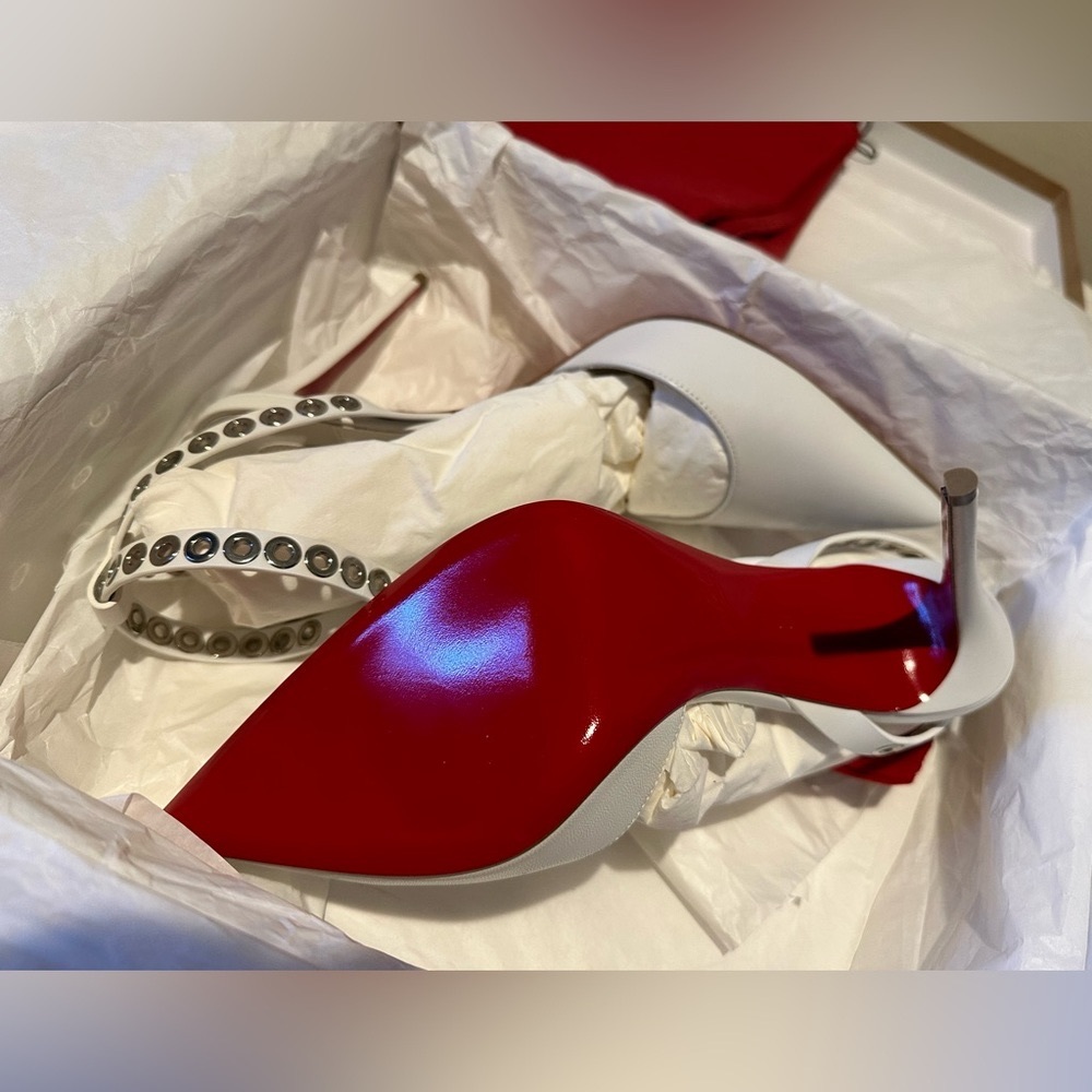 Brand new - never worn Christian Louboutin. White Tstrap - size 39. Asking $800.